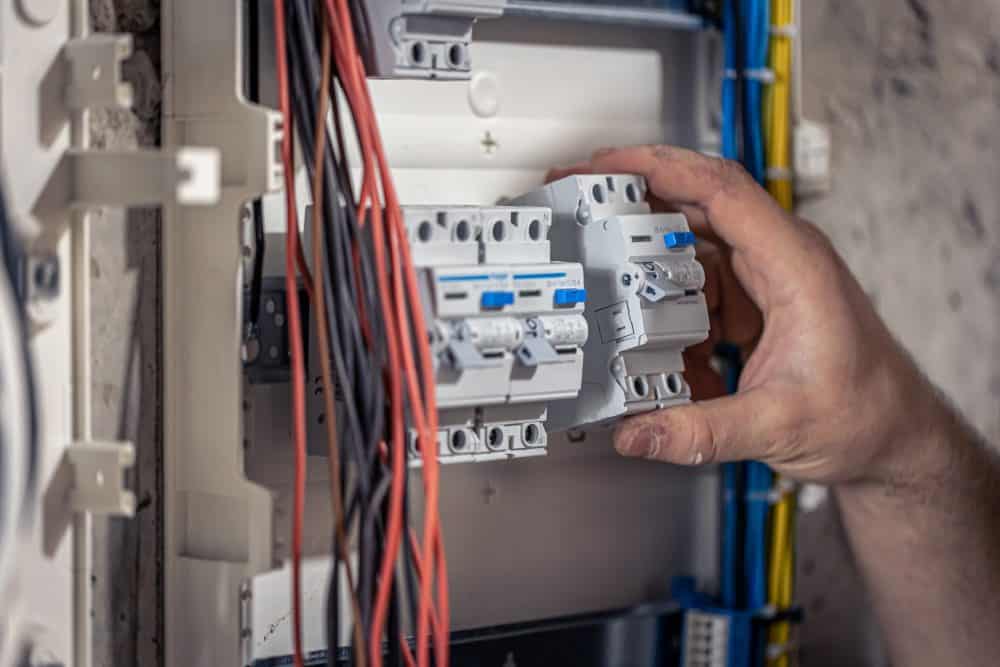 Man holding a circuit breaker